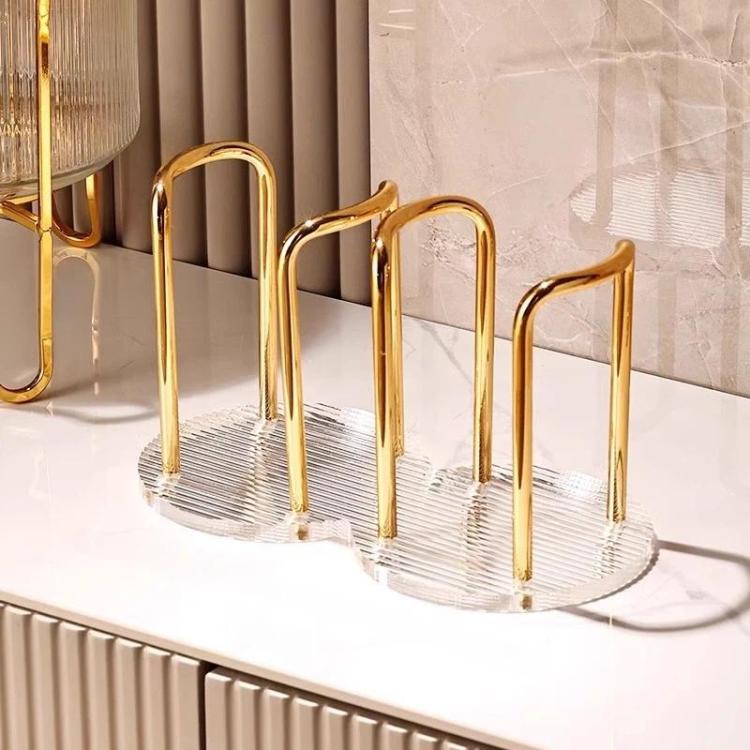 Gold acrylic cup holder for paper cups with four slots and clear ridged base