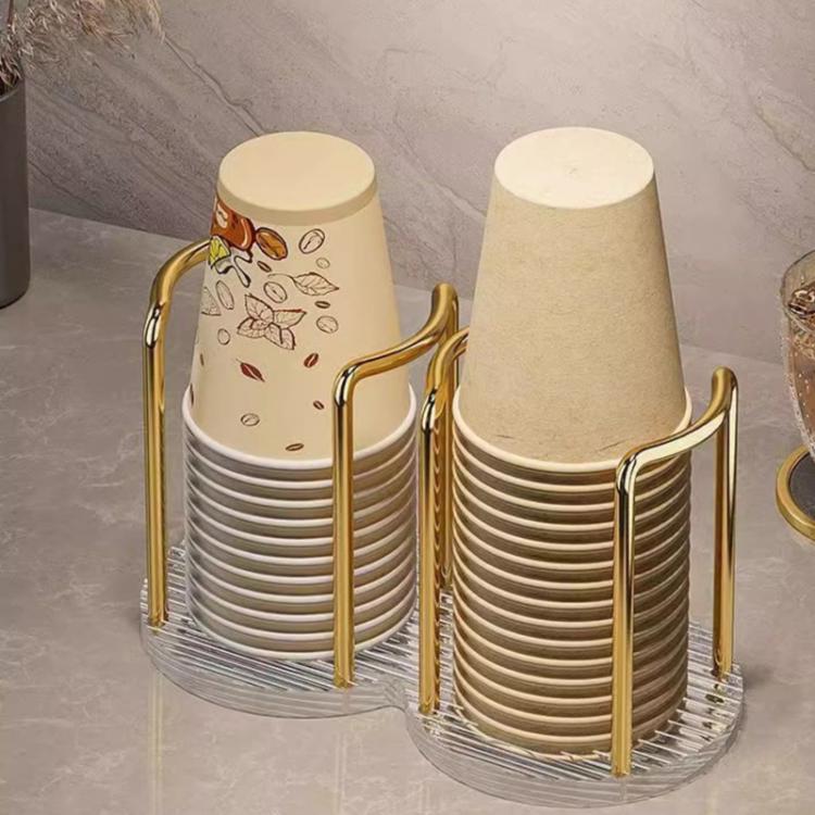 Gold acrylic cup holder holding two stacks of paper cups on a clear ridged base