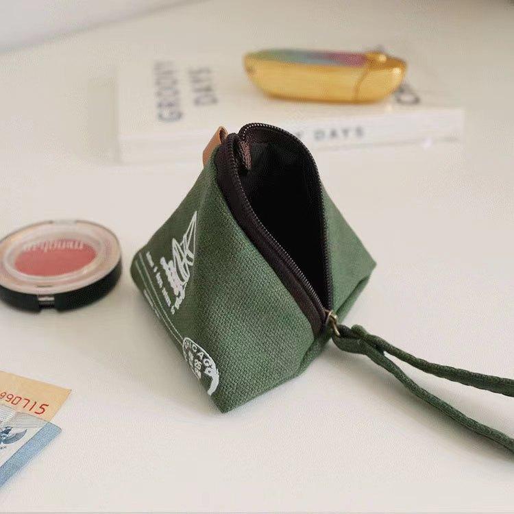 Green zongzi-shaped canvas coin purse with zipper and loop strap, open top