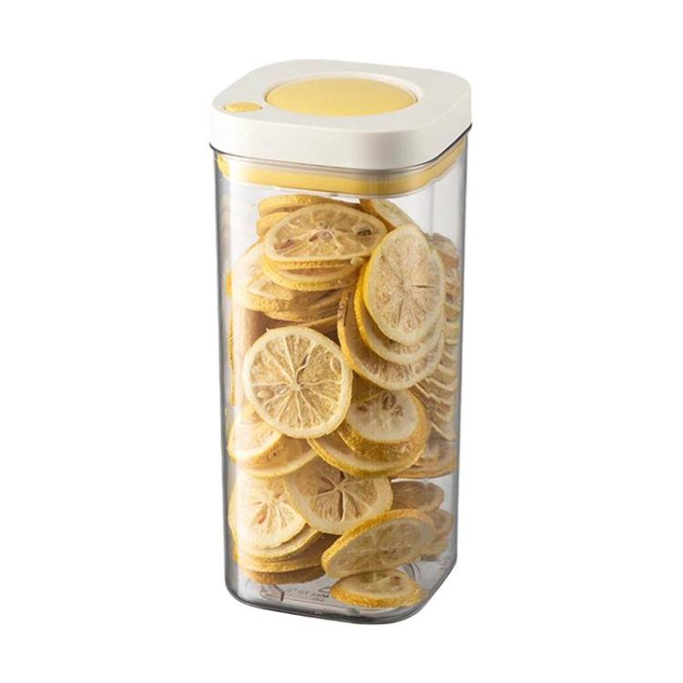 Vacuum food storage jar with yellow lid, clear body filled with dried lemon slices