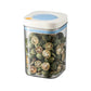 Vacuum food storage jar with blue lid, clear body filled with green dried seeds