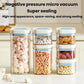 Stacked vacuum food storage jars with blue lids, filled with assorted dry foods