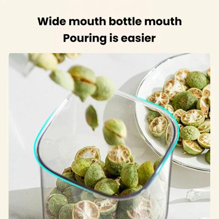 Wide-mouth vacuum food storage jar with blue rim, pouring dried foods inside