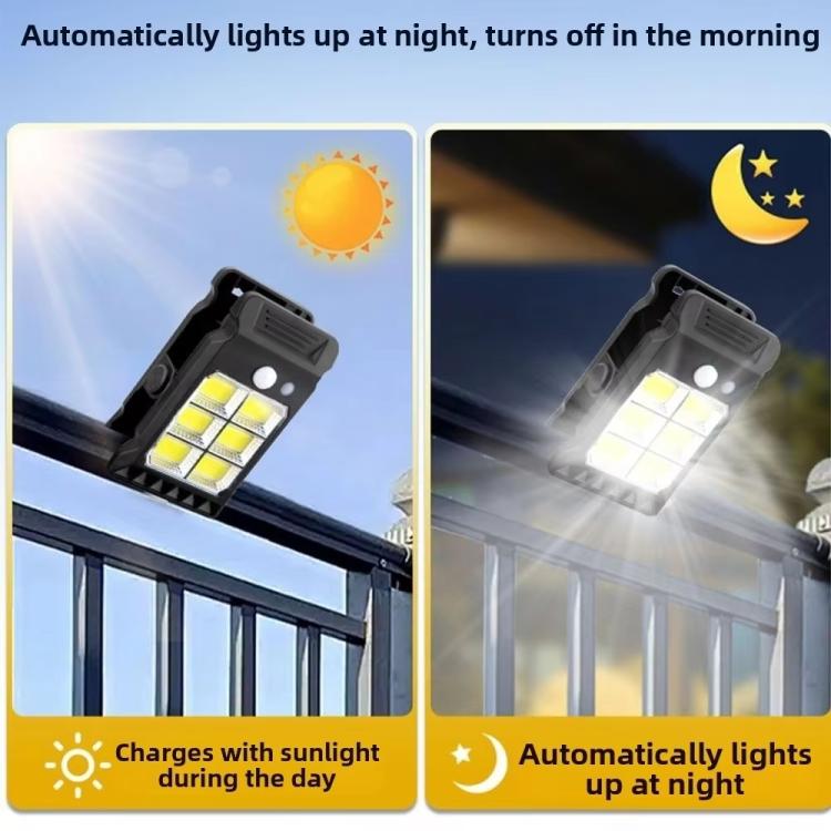 Two black solar clip-on garden lights on railing, bright LED illumination