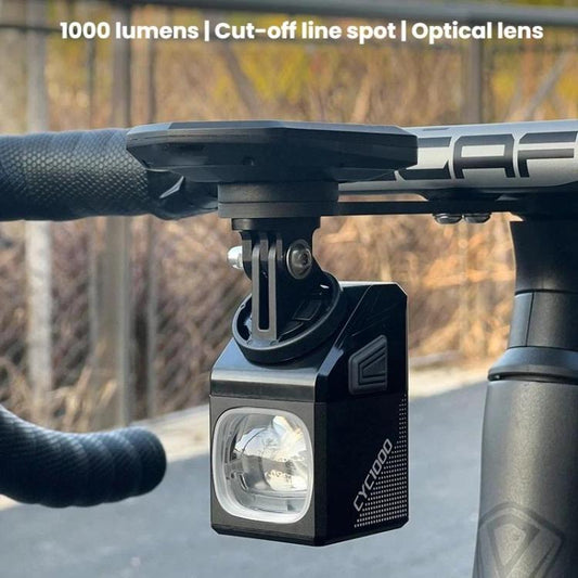 Mounted bicycle front headlight with clamp-style under-mount bracket and lens
