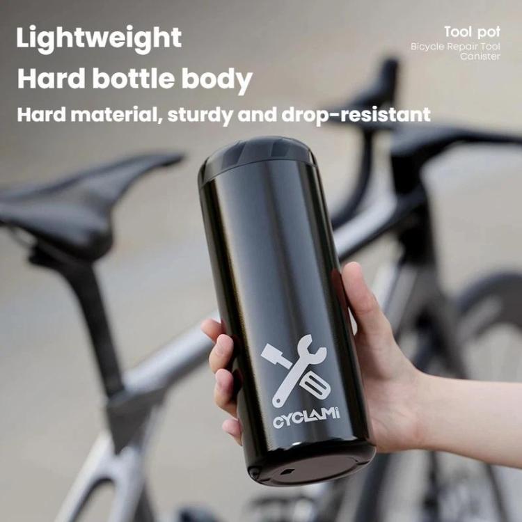 Black hard bottle-style tool canister held in hand