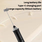 Black wireless milk frother with balloon whisk attachment and spare rod