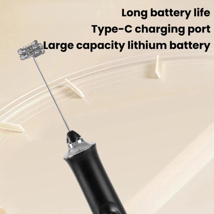 Black wireless milk frother with balloon whisk attachment and spare rod
