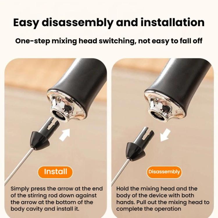 Black handheld milk frother with removable mixing head shown in close-up