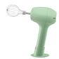 Green handheld electric egg whisk with wire whisk head and flat stand base