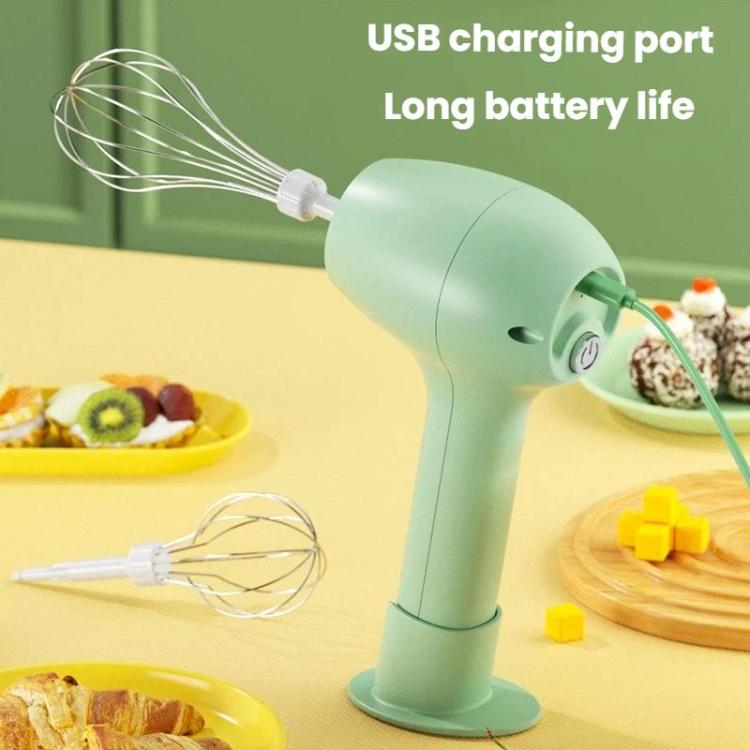 Green handheld electric egg whisk with USB charging cable and stand base