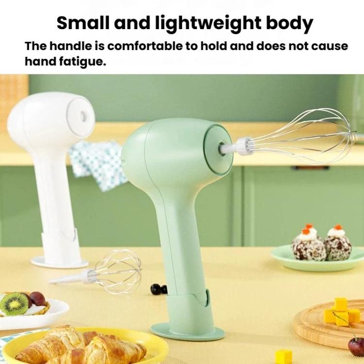 Light green handheld electric whisk with wire beaters and upright stand base