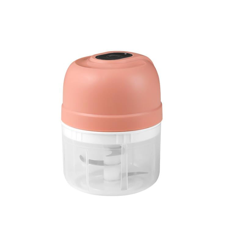 Rechargeable mini food chopper in coral pink with clear bowl and blade assembly