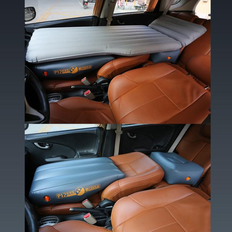 Gray inflatable car mattress laid flat on rear seat for passenger seating