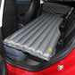 Gray fully inflated car rear seat air mattress with ribbed surface and edges