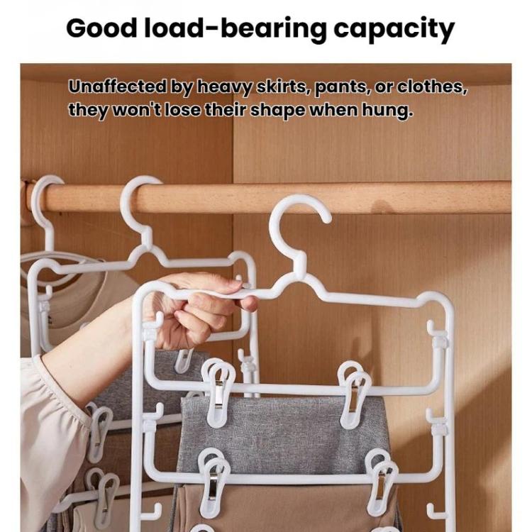 White plastic 3-tier pants hanger with clips holding pants and skirts