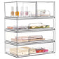 Three-tier transparent cosmetic organizer with open bins for skincare bottles, sticks, and folded items