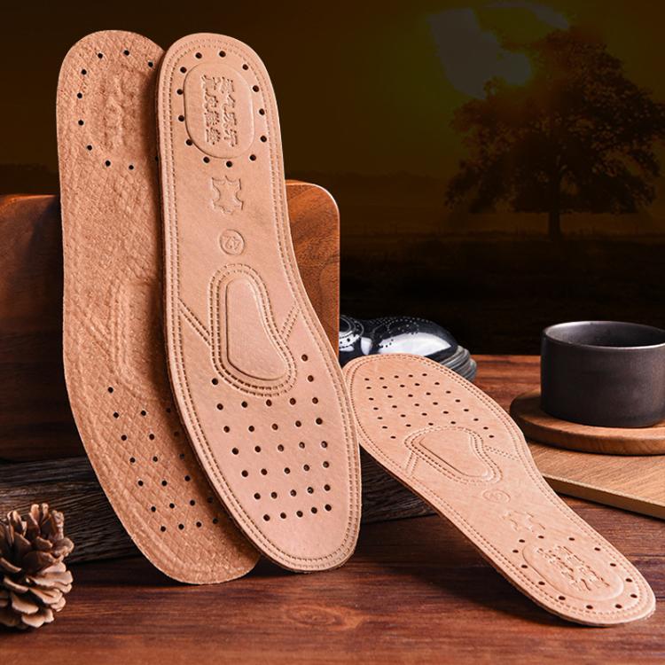 Tan leather insole with perforations and arch support, showing inner underside