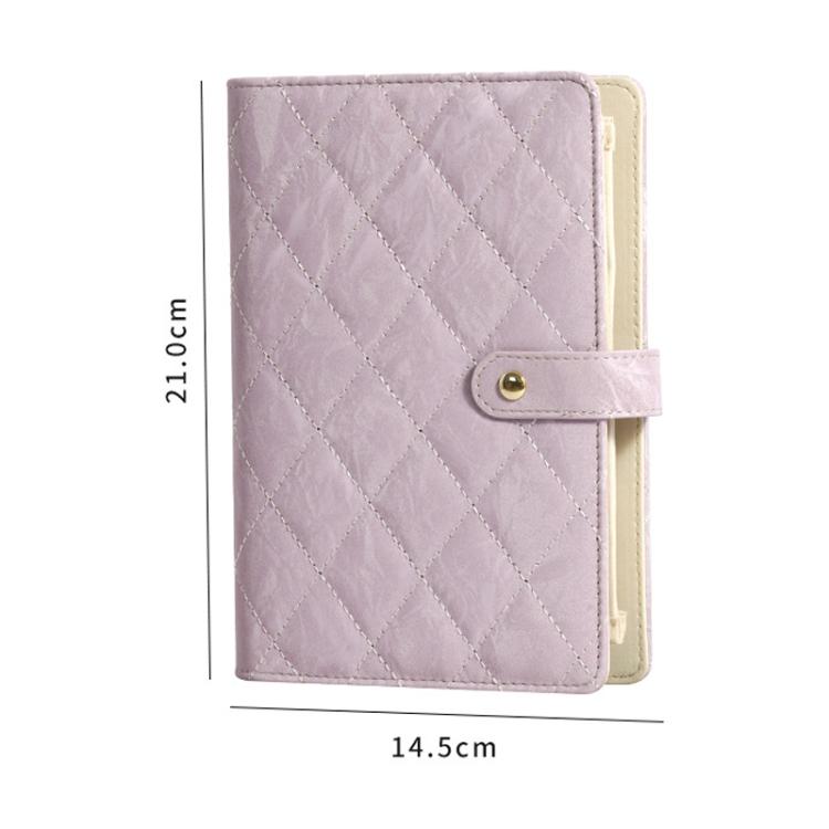 Lavender jewelry organizer book with quilted cover and button closure, portable case