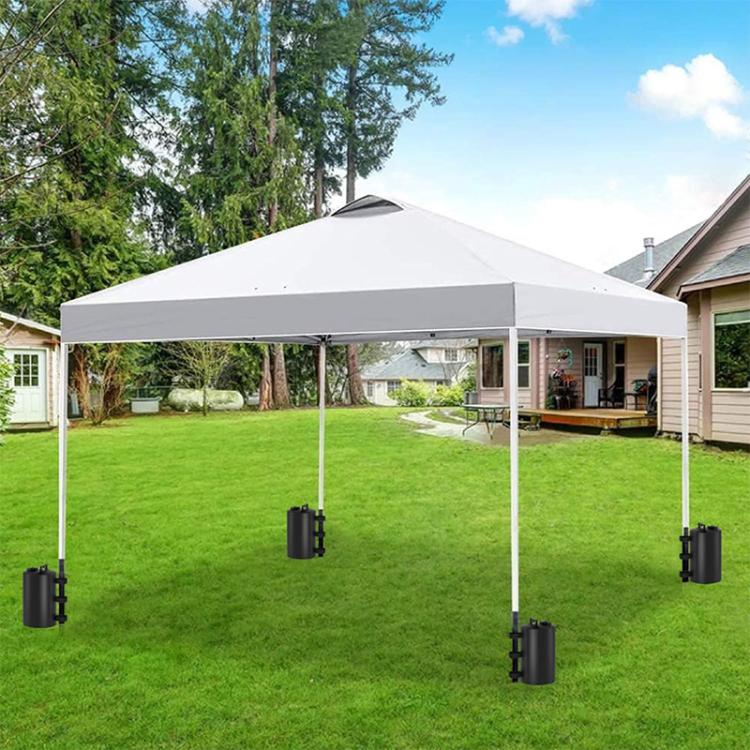 Set of black water-filled tent weight bags hanging from pop-up canopy corners