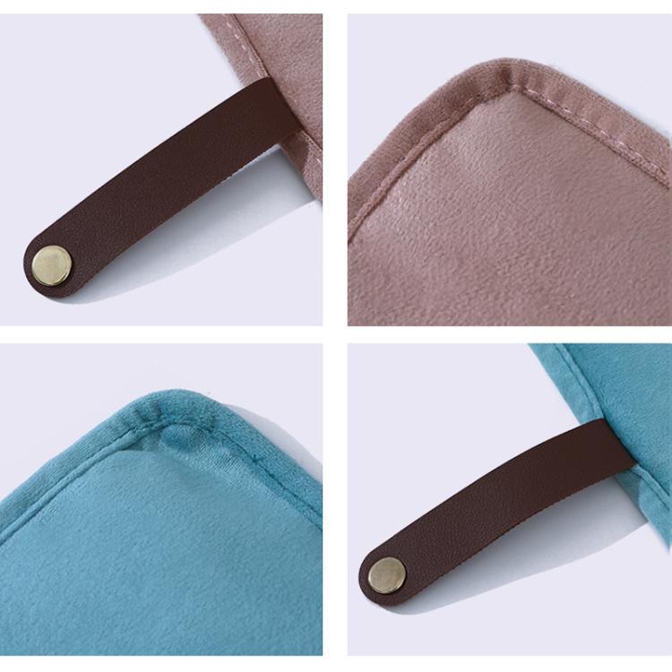 Close-up of roll-up jewelry organizer handle strap and stitched fabric edge detail