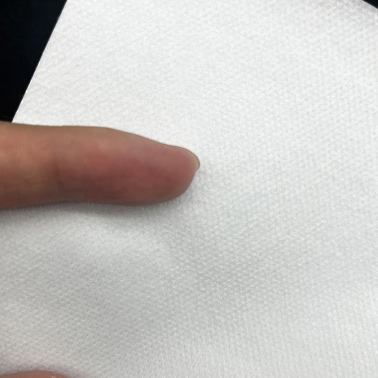 Close-up of white non-woven embroidery transfer paper texture
