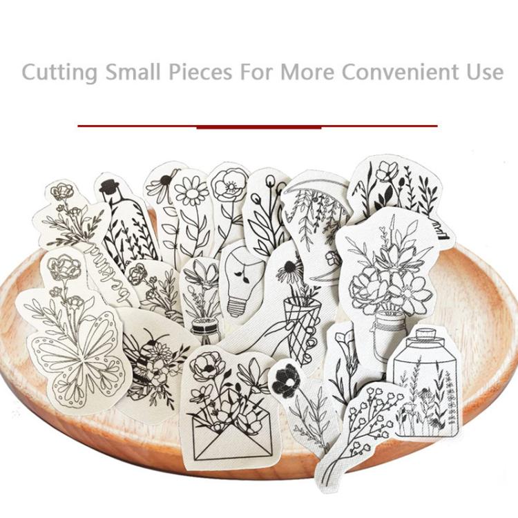 Cut embroidery transfer paper pieces with floral line-art designs