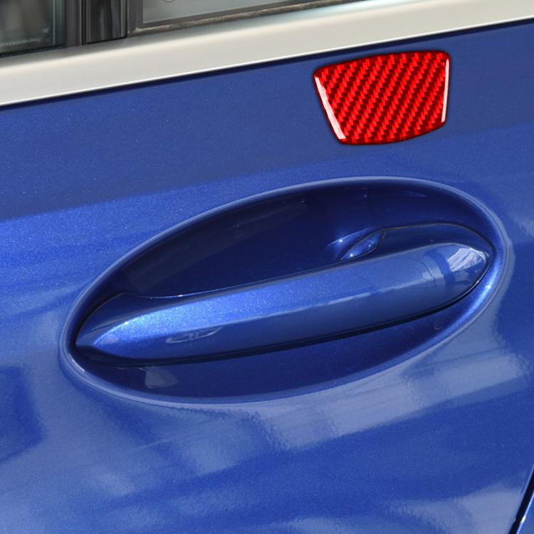 Red carbon-fiber door pillar sticker on blue car door near handle recess