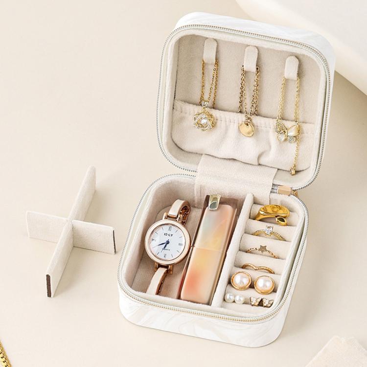 White travel jewelry organizer pouch open with jewelry slots and fitted divider insert.