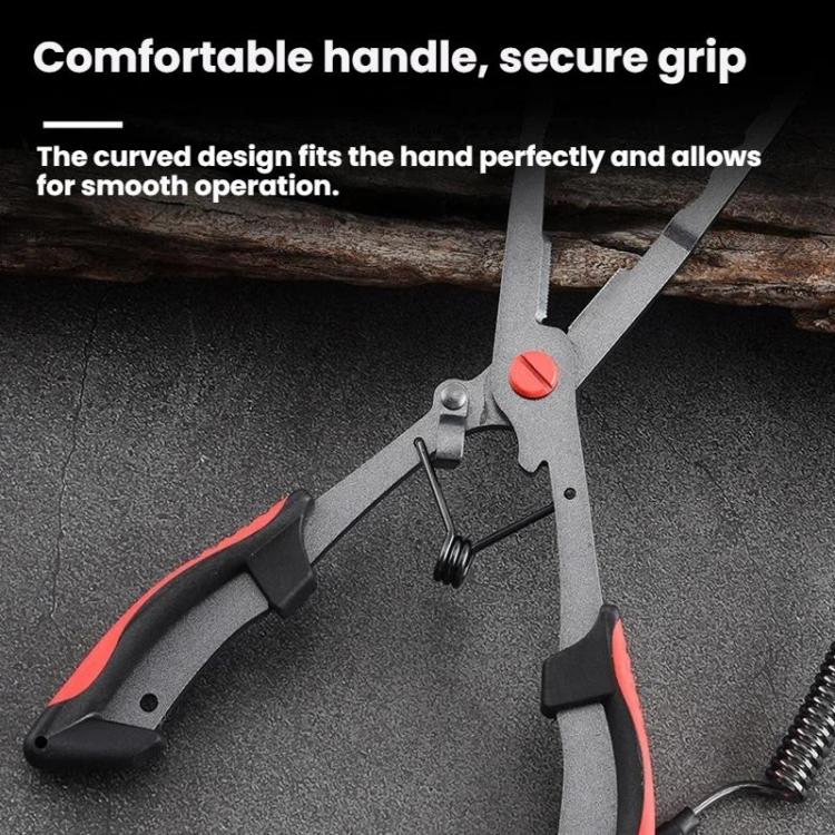 Fishing hook remover pliers with red comfort grips and spring safety cord, close-up