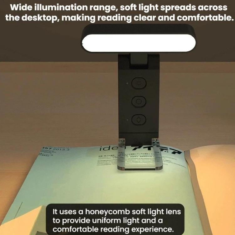 USB rechargeable clip reading lamp with LED folding bookmark on a tabletop, lit.
