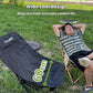 Black folding camping moon chair with padded seat and extended leg support