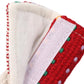 Car seat belt shoulder cover close-up of red woven fabric with white stitched edge