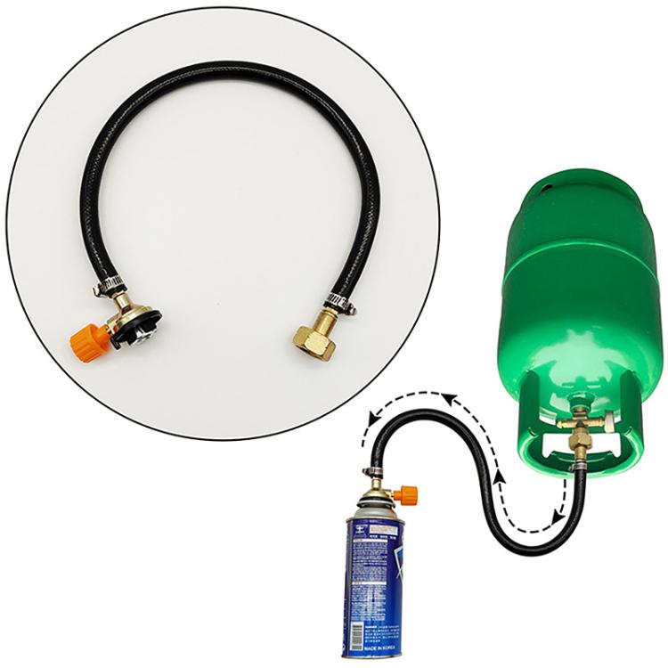 Outdoor inflation system with green regulator head, hose, and orange gas-canister adapter
