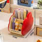 Red cosmetic storage rack with open front holds makeup tubes and two cartoon figurines