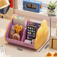 Purple and yellow cosmetic storage rack with open front holds pens, scissors, and a smartphone