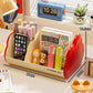 Cream cosmetic storage rack with red side panels holds markers, a color-in book, and a phone