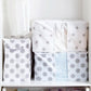 Stacked cube storage bags with gray dot and star prints and see-through window panels