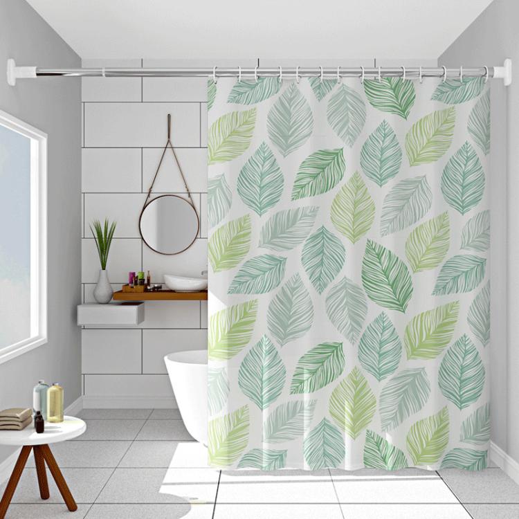 Leaf-pattern shower curtain with green and yellow leaves on white, ring-top hanging