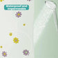 Close-up of flower-printed shower curtain with water spray over the fabric