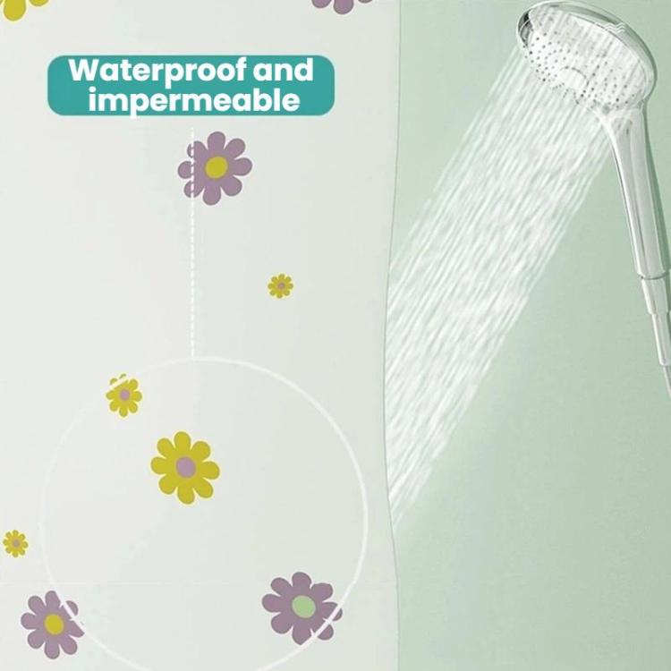 Close-up of flower-printed shower curtain with water spray over the fabric