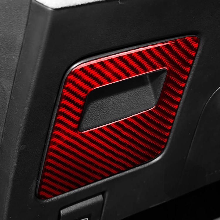 Red carbon-fiber glove box handle trim sticker with rectangular cutout, close-up