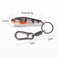Fish lure keychain with keyring and spring clip, blue and red multicolor painted body.