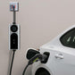 Wall-mounted EV charger with display connected to car charging port via cable