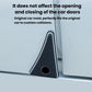 Black triangular car door corner protector with circular hole near car door seam