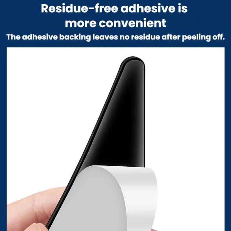 Hand peeling backing from black triangular car door corner bumper guard sticker