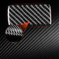 Black carbon-fiber pattern decorative sticker with rounded rectangular shape, close-up