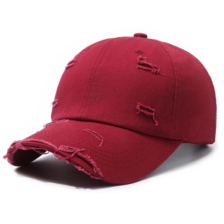 Distressed red ripped baseball cap with frayed brim and distressed front stitching