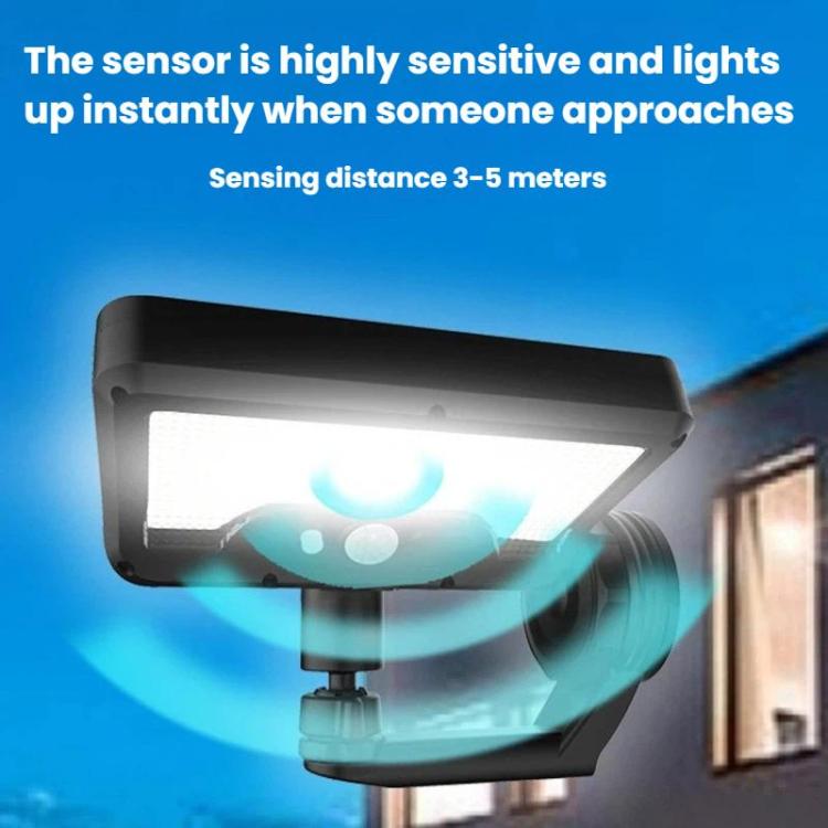 Solar motion sensor wall light glowing white with wide detection beam, black