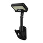 Black solar motion sensor clip-on light with rectangular solar panel and mounting post